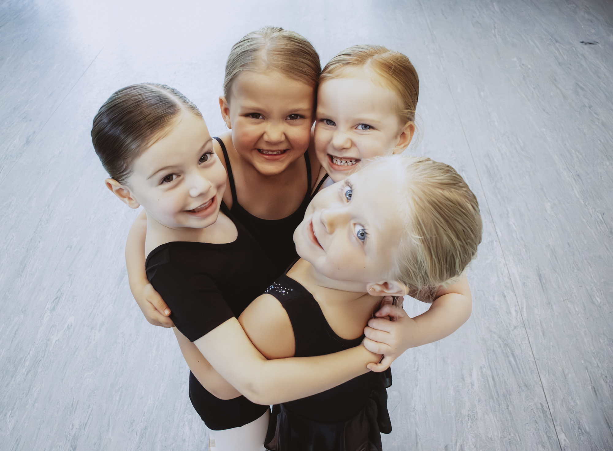 Young dancers participating in Snowflake Spectacular movement games at Miller Street Dance Academy
